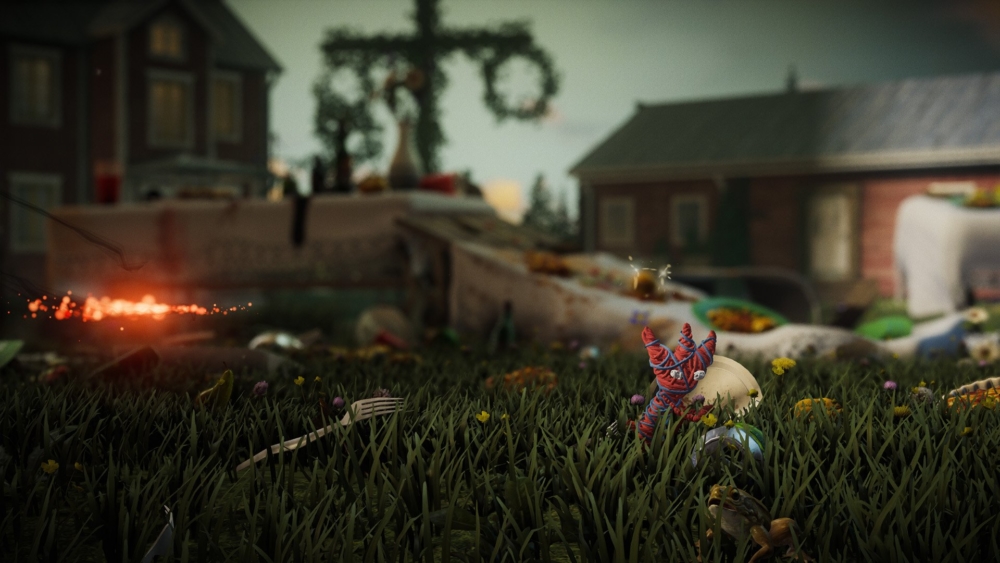 The small woven character runs across a partied-out lawn.