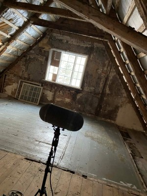 Mikkel Nielsen and Peter Albrechtsen recording windy rooftop ambiences for the family house