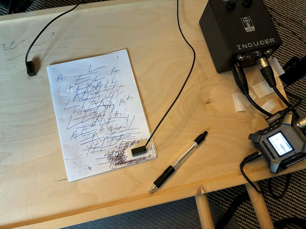 Assistant sound designer Mikkel Nielsen recording sounds of the pencil writing with a contact mic for the Morse code sequence