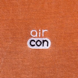 Limited edition orange AirCon26 T-shirt