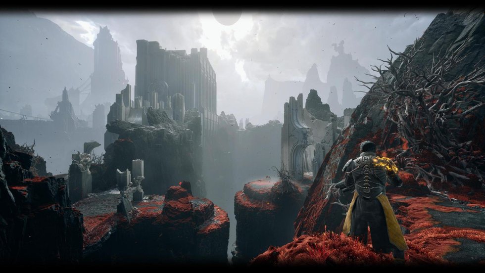 A misty Carcosa biome with red vegetation clinging to the rock in Saros