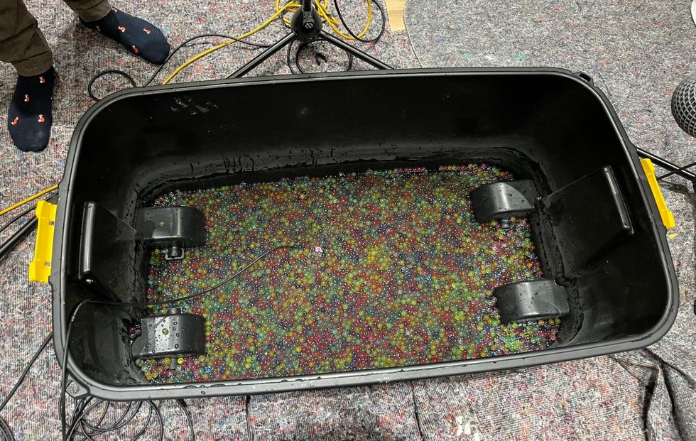 A tub of water beads miked up for a liquid and goo recording session on Saros