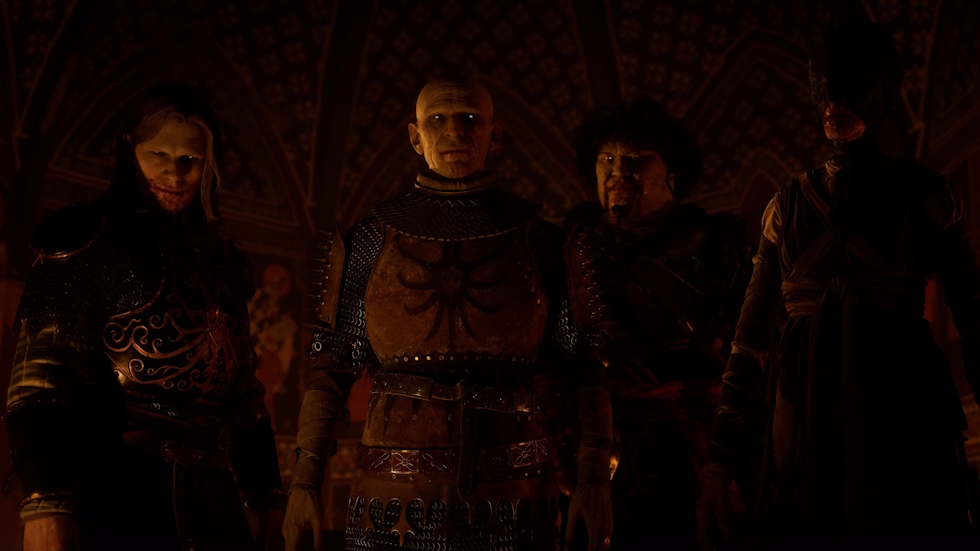 Four vampires stand together in a dark, candle-lit hall